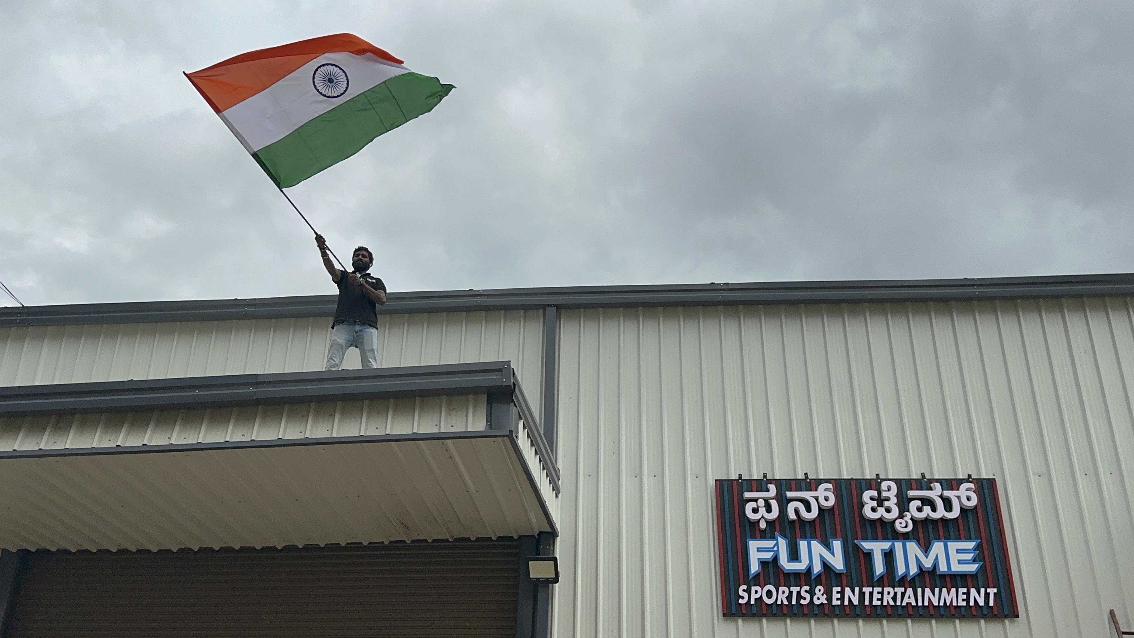 modern manufacturing workshop with engineers designing arcade machines, bright industrial space, professional team collaboration, cinematic