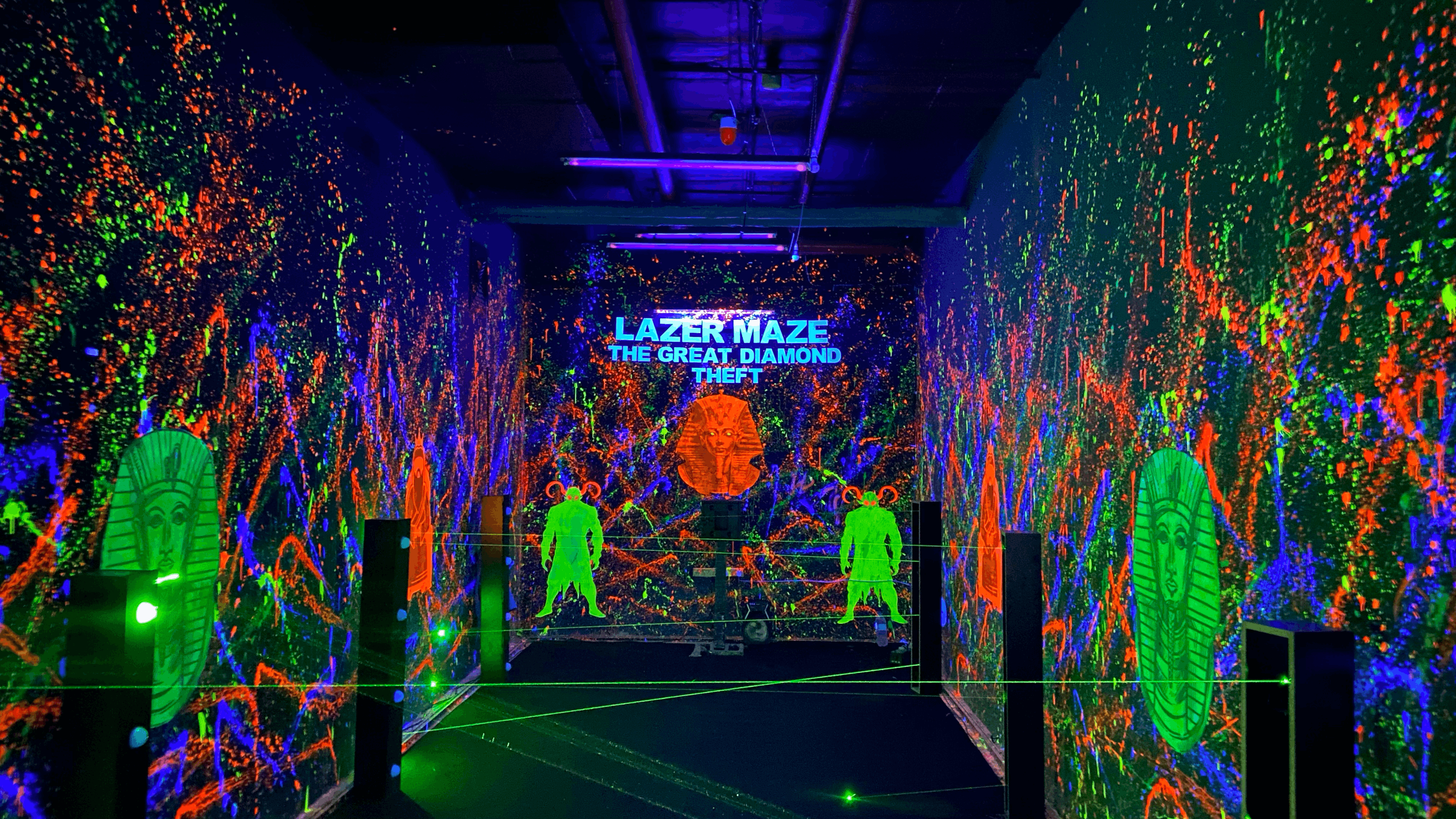 Laser maze arena with players dodging beams