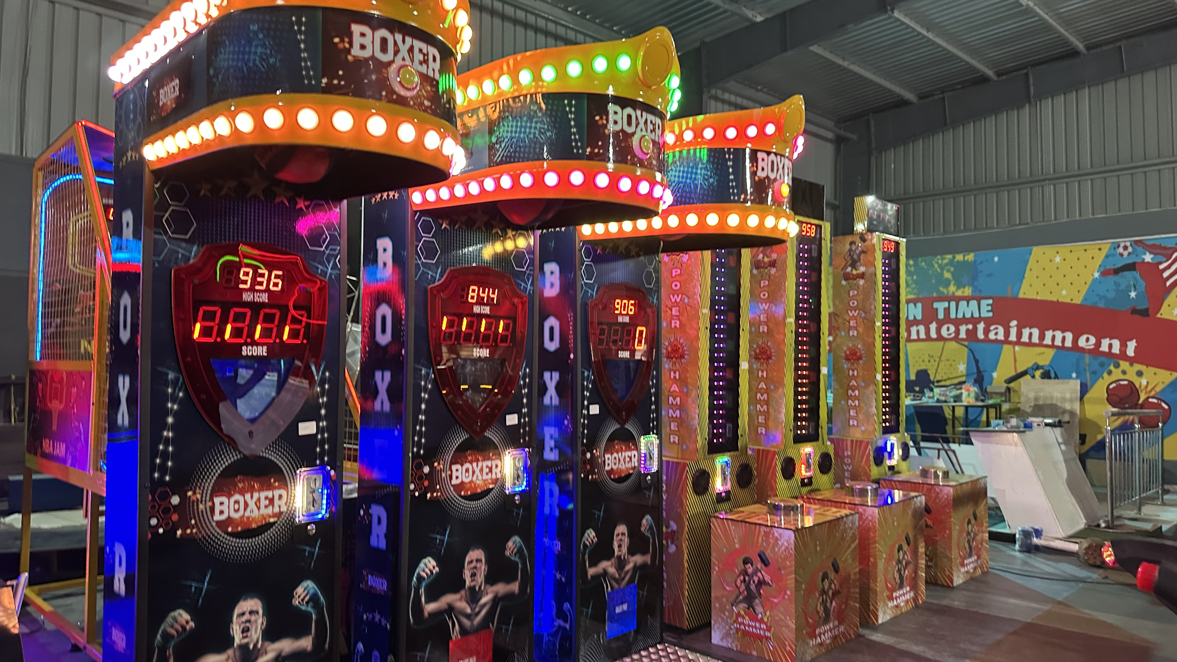 bustling family entertainment center with arcade games, energetic atmosphere, modern game zone with people playing, colorful LED lights, profitable venue, wide angle shot