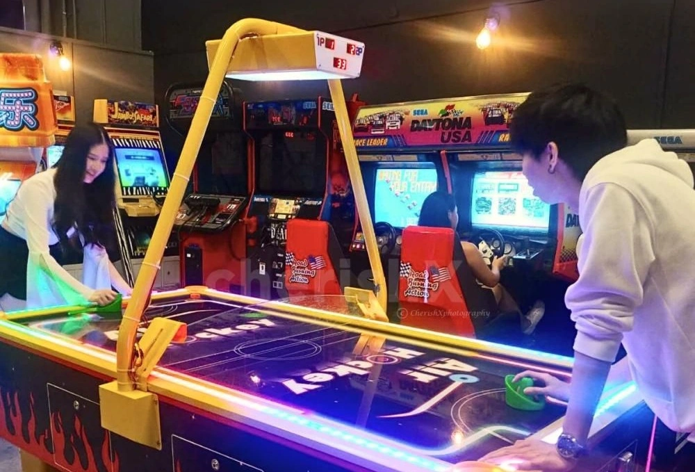 Experience the thrill of air hockey designed for adults, showcasing competitive gameplay and engaging fun. Perfect for social gatherings and entertainment.