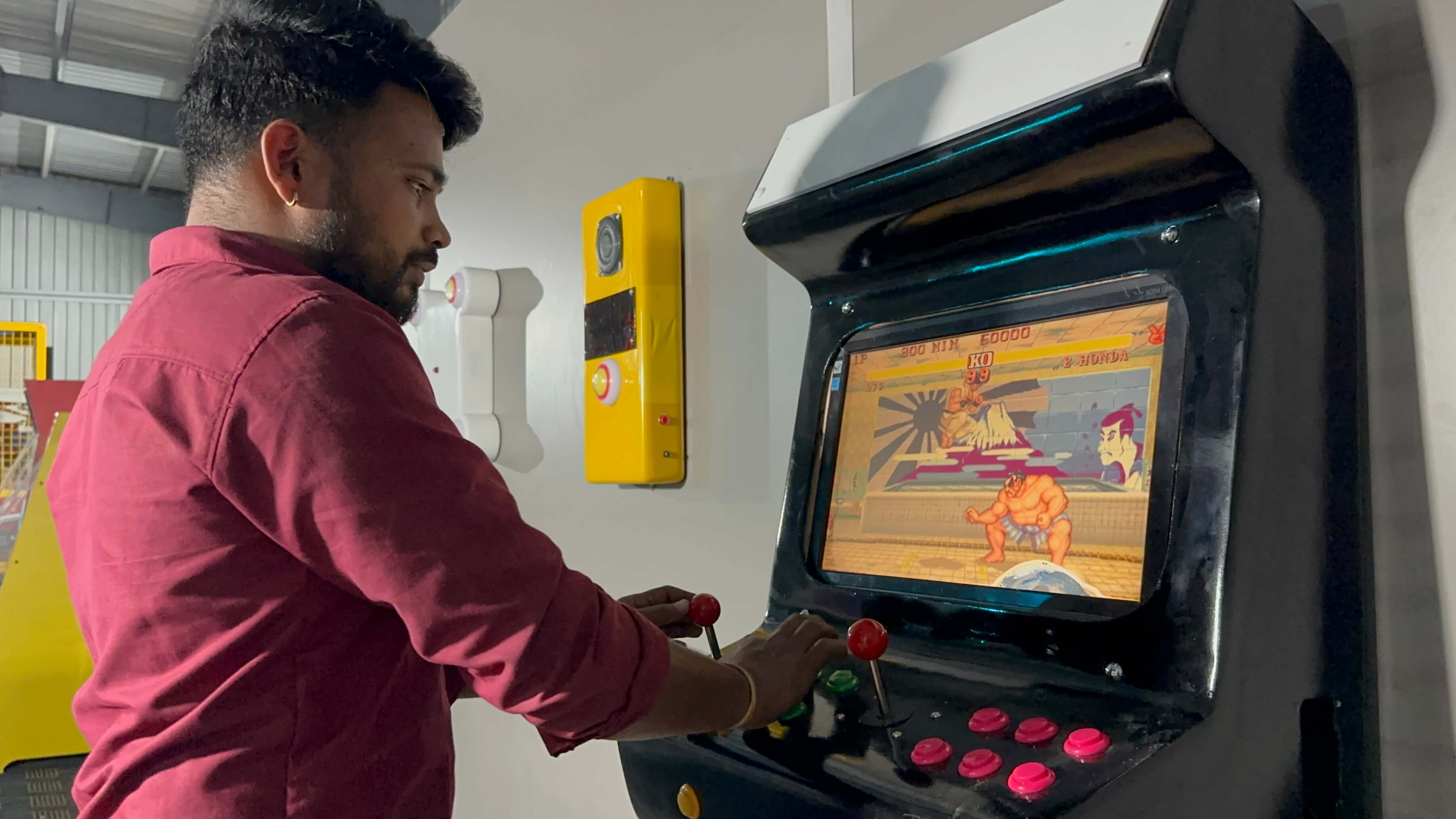 one punch boxing arcade machine in action, person punching, LED score display, modern arcade interior, dynamic lighting, professional photography